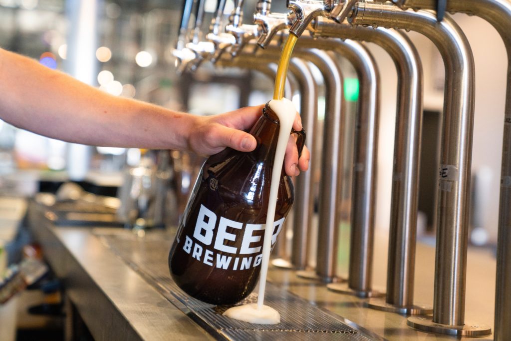 beer pouring out of tap - Crew Connection