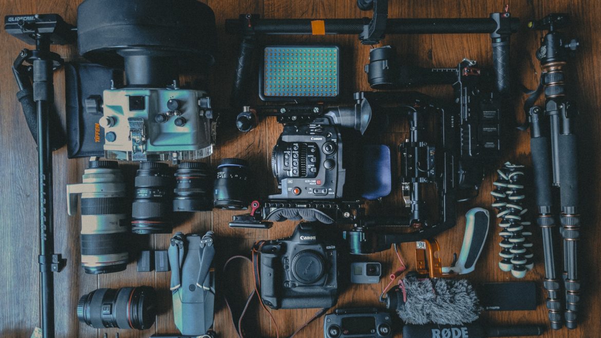 camera gear on table - Crew Connection