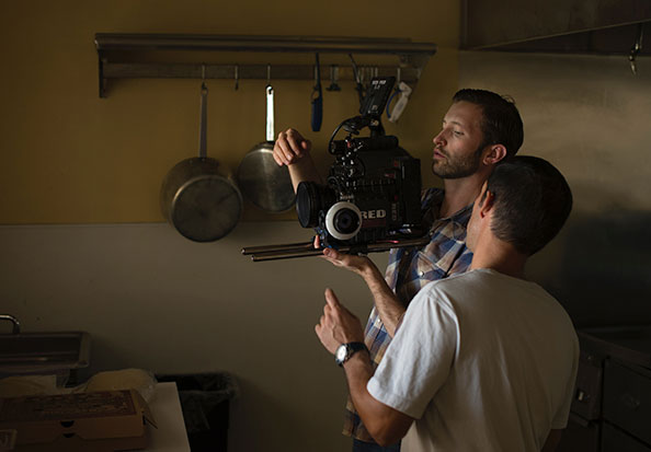 two people working with video camera - Crew Connection